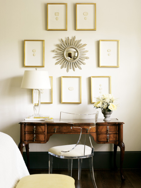 An antique desk, handed down to the designer from her mother, underscores a collection of antique intaglios.
