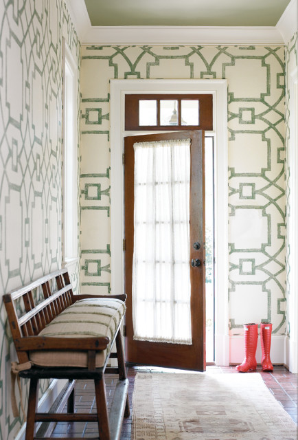 The one exception to this home’s subtle neutral scheme can be found in the back hallway, where Womack Jowers upholstered the wa