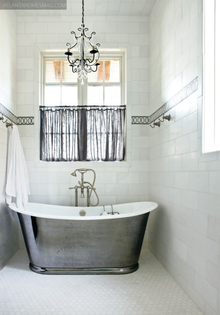 From a cheerful guest bedroom overlooking the lake to a bathroom with a view, Sumblin Schnell said there is no sheetrock in the house at all. Rather, natural materials were used to draw the outside in.