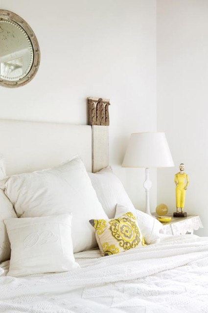 Not one to settle for conventional headboards, Williams had one crafted for the master bedroom out of old French pilasters, another for a guest room out of antique Chinese doors. Soft furnishings in both sleeping spots are intentionally understated, allowing collectibles, such as an array of cogs, shoe forms and antique carts to be fully appreciated.