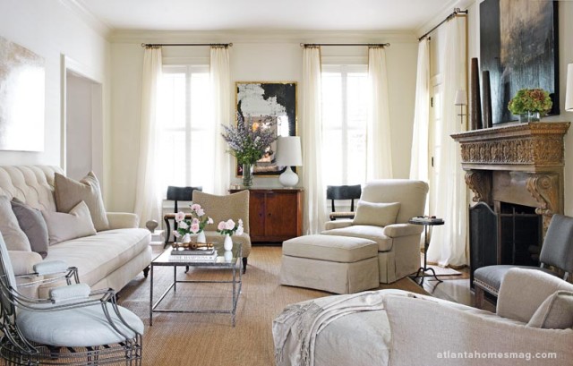 Soft neutral hues give the living room a comfortable and relaxed feeling. Even the art over the fireplace “keeps it romantic,” says Howard. “It sort of brings the room down a notch, makes it more casual.” Further enhancing the laidback look is a heavily antiqued mirror, which the designer was lucky enough to find at an antiques market.