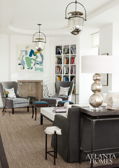 Westbrook selected a shimmery pair of Urban Smokebell hanging lanterns by The Urban Electric Co. as a focal point in the living room. Hanging prominently over the fireplace mantel is an abstract painting, artist Brian Coleman’s “Hard to Explain,” from Anne Irwin Art.