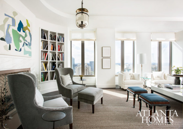 On the 38th floor of the Residences at Mandarin Oriental, Atlanta, “each piece of furniture is curated and not a placeholder,” says Barbara Westbrook. In the living room, that thoughtful mix includes modern seating, such as grey wing chairs from Bungalow Classic, and a pair of antique stools in teal blue wool from Holland & Sherry.