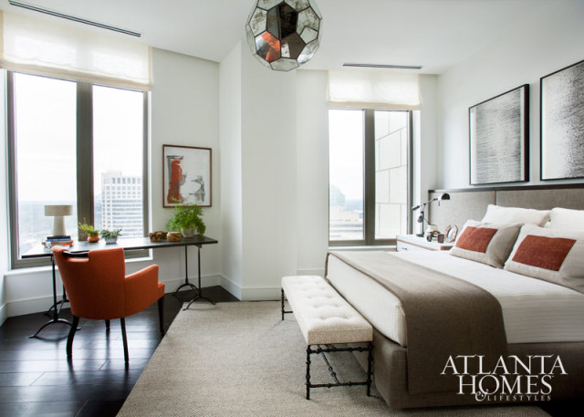 “Although I love neutrals, I find myself attracted to colors that have something to say,” says Westbrook, who punctuated the neutral-colored guest room with dashes of orange. A series of works by Jeremiah Johnson hangs above a custom-designed upholstered headboard and bedside tables. The room’s crowning touch is a mirrored pendant light from Stanton Home Furnishings.