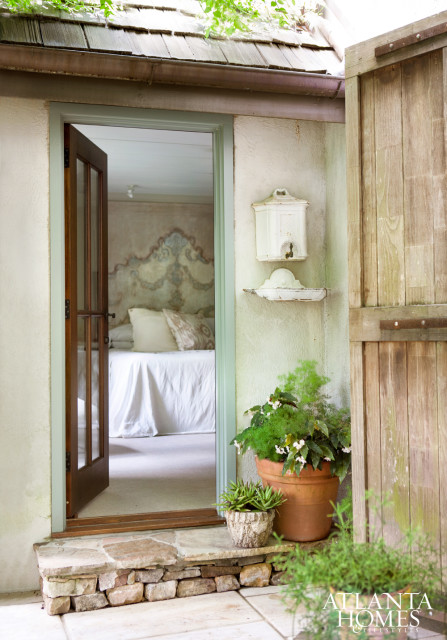 With an idyllic backdrop including winding pathways, a pool and flowering arbors just outside its door, the master bedroom feels more like a resort-like retreat.