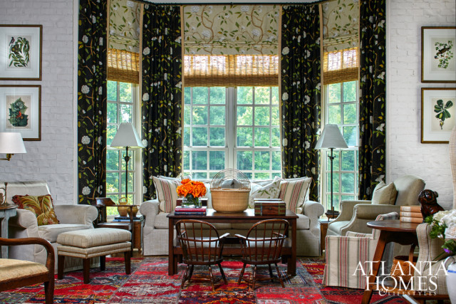 Designer Stan Topol infused the living room of this Newnan farmhouse with a multitude of lounging options, including a club chair and sofa from Cameron Collection.