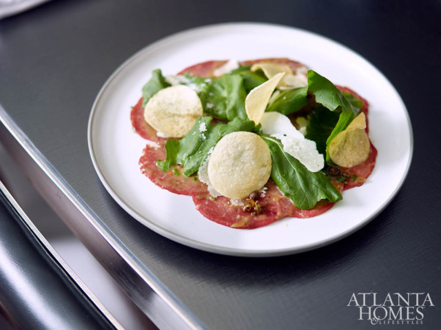Beef carpaccio with horseradish, sorghum vinaigrette and smoked potato chips.