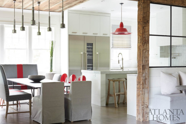 Rustic flourishes temper the clean lines of this mountain retreat designed by Kay Douglass. She procured many of the furnishings, including this dining table and mix of seating, from South of Market, her interiors showroom in Atlanta brimming with unique finds.