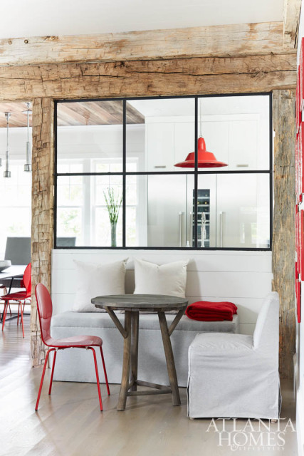 A charming dining nook designed for the children is framed by reclaimed barnwood.