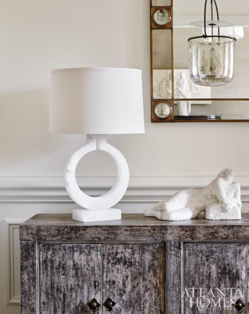 Designer Beth Webb selected a Gansu buffet from Bungalow Classic to display an alabaster lamp and reclining nude plaster.