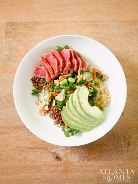 The grain bowl, served with quinoa, seared tuna, cucumber, edamame, kale, avocado, almonds and a sesame soy vinaigrette.