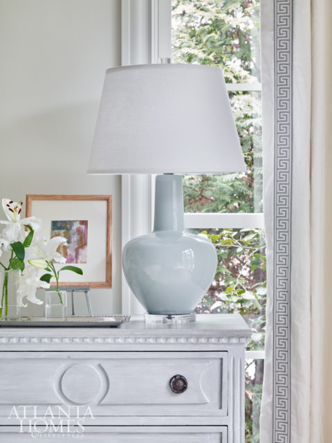 Greek key trim on the draperies are a timeless touch echoed elsewhere in the home.
