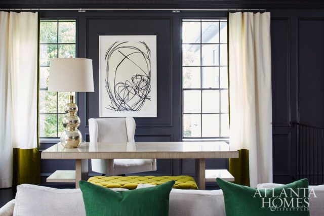 Artwork by Susan Hable holds court above the Bradford library table in the husband’s office.
