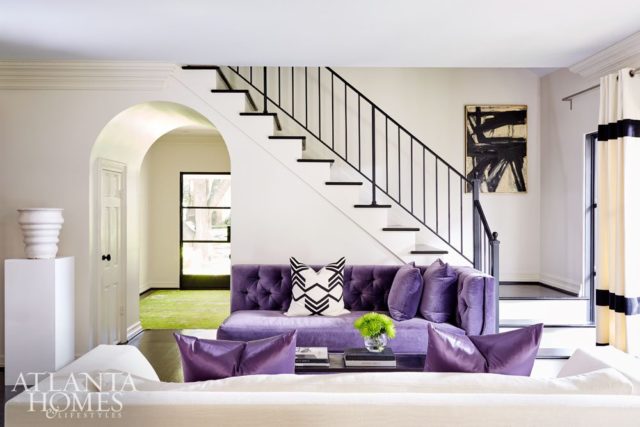 Neutral walls (Seapearl by Benjamin Moore), and vibrantly hued furnishings, such as a plush purple arm chaise and matching slate-colored chaises (all from South of Market), add a cheerful disposition to the main-level living spaces.