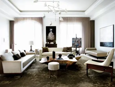Living room with white sofas, a live-edge wood coffee table, a tan chaise lounge, and modern art on the walls.