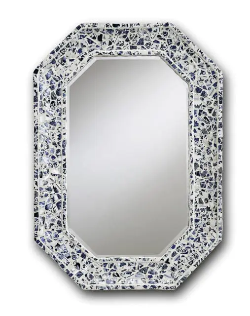 Octagonal mirror with frame made of broken blue and white ceramic shards arranged in a mosaic pattern.
