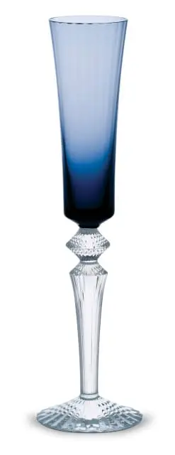 Tall champagne flute with a gradient of blue to clear glass, faceted crystal stem, and a fluted crystal base.