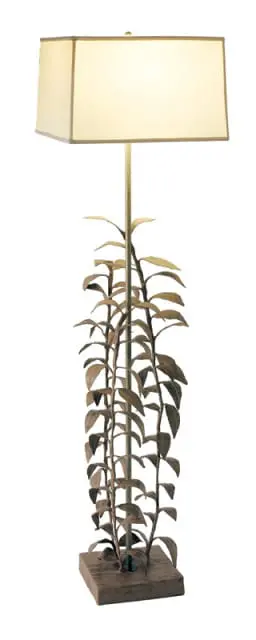 Floor lamp with a rectangular cream shade and a metallic stem adorned with sculpted leaves and a square base.