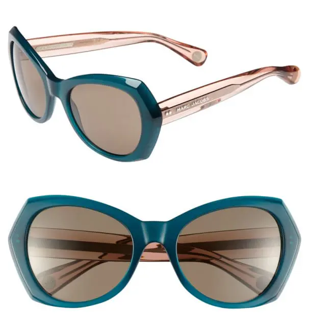 Teal cat-eye sunglasses with light pink temples and brown lenses. Text on the temple reads 'MARC JACOBS'.