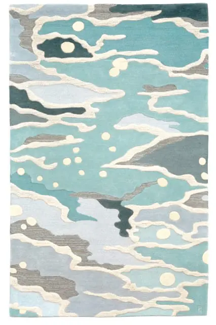 Abstract rug with flowing shapes in shades of blue, teal, gray, and cream, with scattered cream circles.