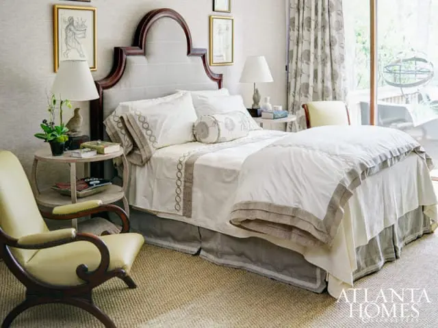 The sharp green in the neutral space reminded Carole Weaks of the limelight hydrangeas often seen in the area and packed the punch against the wood and stone walls. But it was the Travers fabric from Ainsworth-Noah that Weaks knew she had to include, drawn to the environmental feel of the wool appliques against the crisp linen. The fabric was used for the draperies, chair, headboard and dust skirt, with drapery and pillows by Barter & Galambos. On the walls, a Phillip Jeffries woven acted as an anchor for the various textures in the room, which also featured stone birds fashioned into sculptural lamps from Dessin Fournir. The adjacent outdoor space was spacious enough for lounge chairs, a dining table and chairs from Kolo Collection and a Dessin Fournir bench.