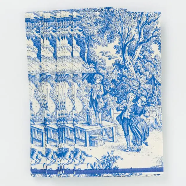 Blue and white toile pattern depicting a pastoral scene with figures, animals, and trees.