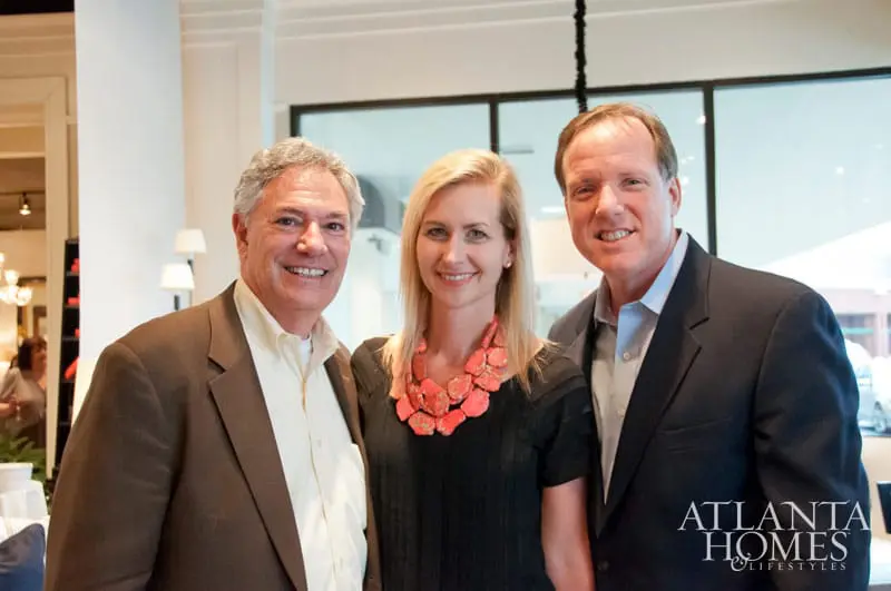 Three people smiling for a photo, with the Atlanta Homes & Lifestyles logo in the lower right corner.