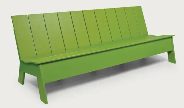 Close-up of a bright green wooden bench with vertical slats on the back and a flat seat.