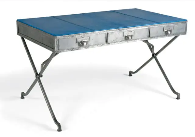 Metal desk with three drawers and a blue leather top, supported by crossed metal legs.