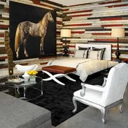 Bedroom with a large painting of a horse above a bed, a textured accent wall, and a seating area with a glass coffee table.