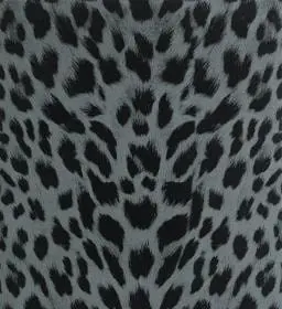Close-up of a grey and black leopard print pattern on fabric.