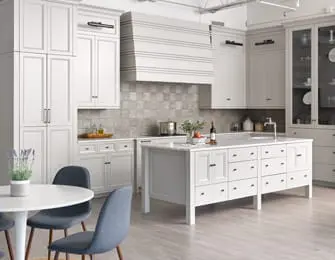 White kitchen with custom cabinetry, a large island with drawers, a tiled backsplash, and a striped range hood.