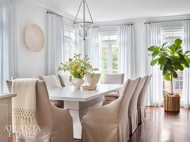 white dining room with glass chandelier