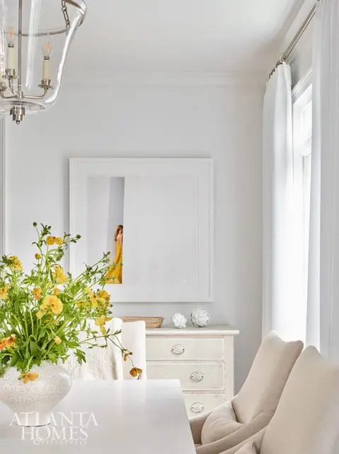 white dining room with art