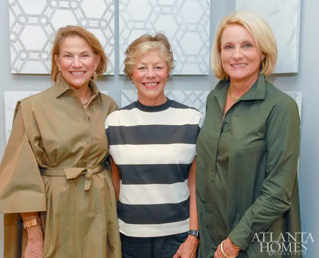 Three women smiling, with Atlanta Homes & Lifestyles logo in the corner.