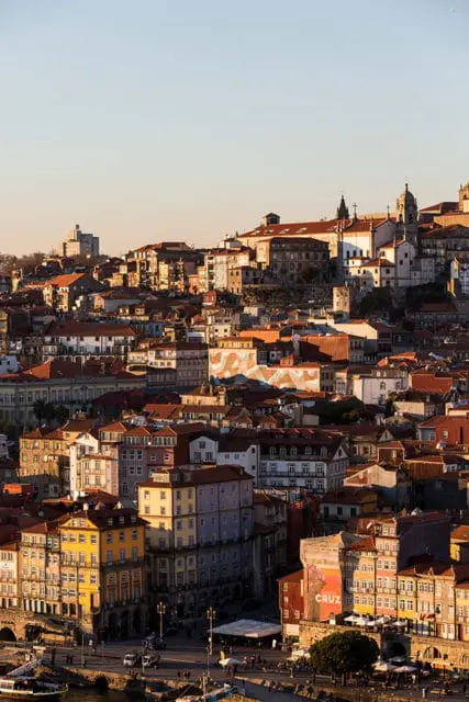 Cityscape with colorful buildings and churches at sunset