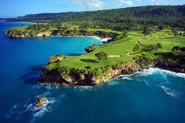 Golf course on a cliff overlooking the blue ocean in the Dominican Republic.