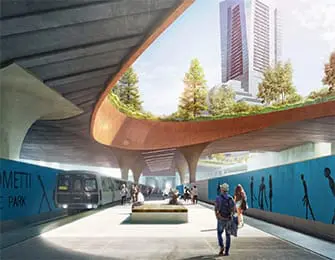 Modern train station with green roof, people, and cityscape background