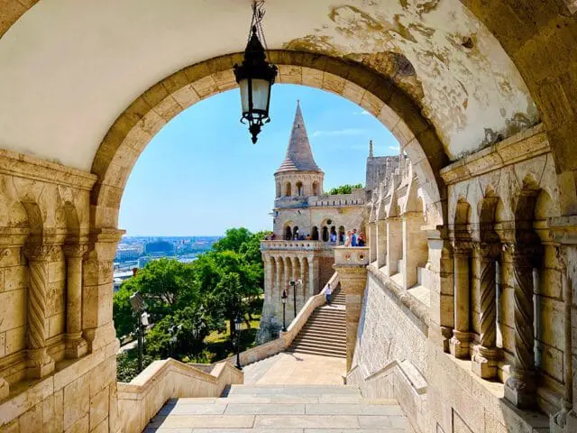 Fisherman's Bastion with stone arches, stairs, and city view