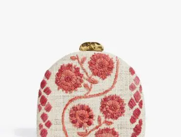 Straw clutch with embroidered pink floral pattern and gold clasp