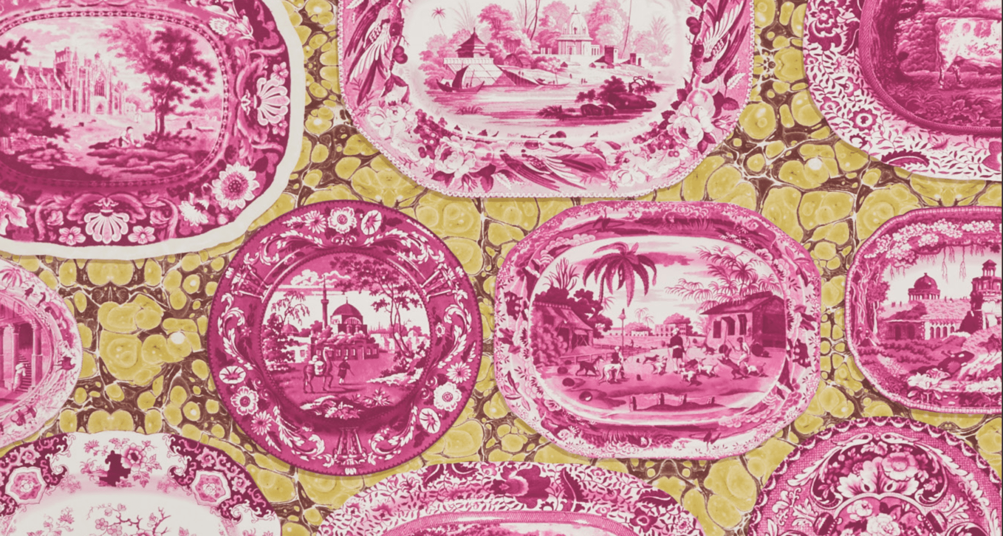 Pink and white toile pattern plates with scenes of architecture and people on a yellow marbled