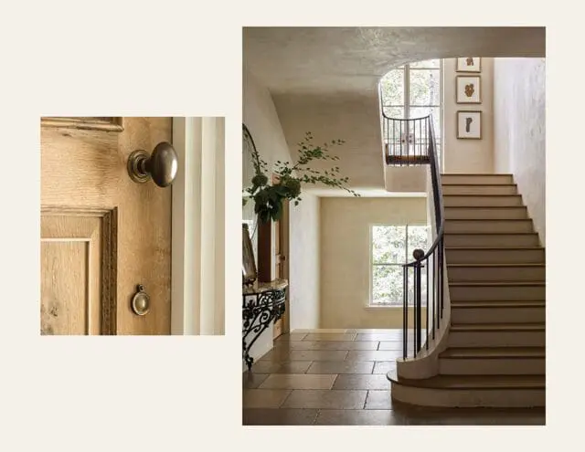 Curved staircase with wood treads and black railing, stone floor, and artwork on wall.