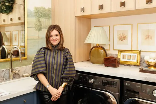 Woman in striped shirt in laundry room with LG washer and dryer