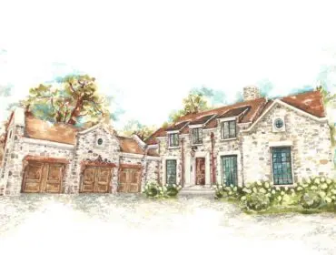 Stone house with multiple garages and a red tile roof, surrounded by trees.