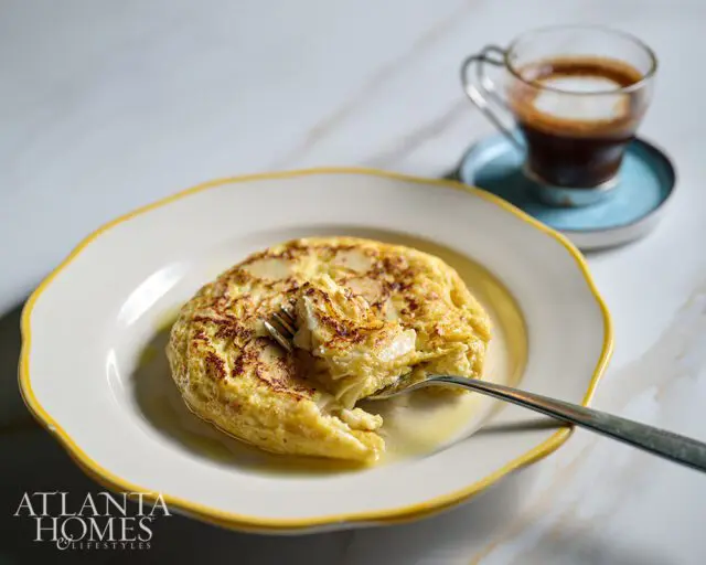 Atlanta Homes & Lifestyles logo on a plate with a frittata and espresso