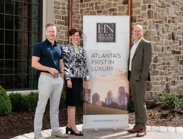 Harry Norman Realtors banner with Atlanta skyline and text "Atlanta's First in Luxury"