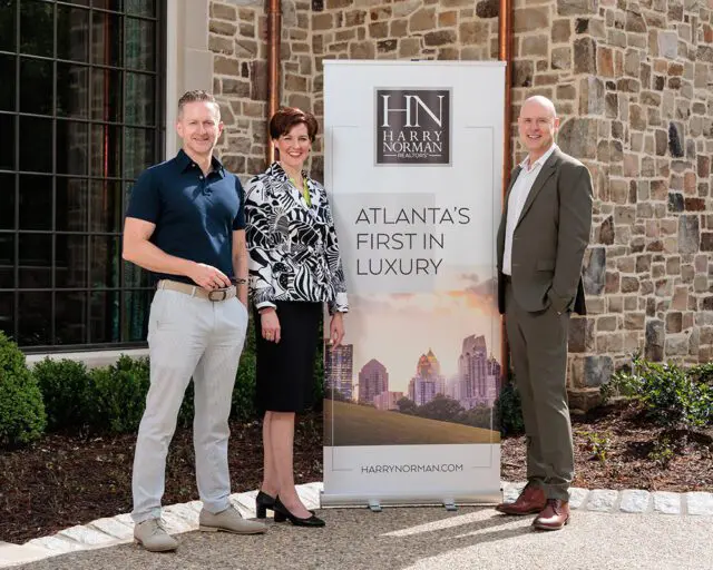 Harry Norman Realtors banner with Atlanta skyline and text "Atlanta's First in Luxury"
