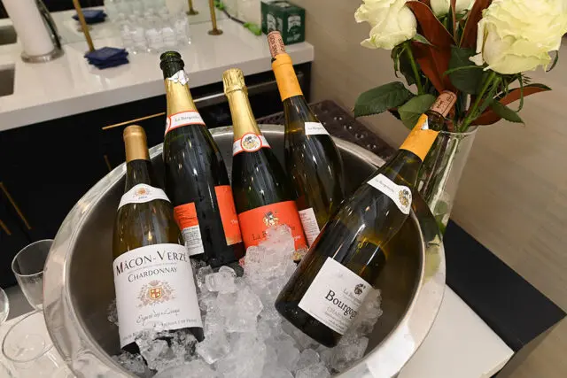 Bottles of Macon-Verze Chardonnay and La Burgondie Bourgogne Chardonnay chilling in ice