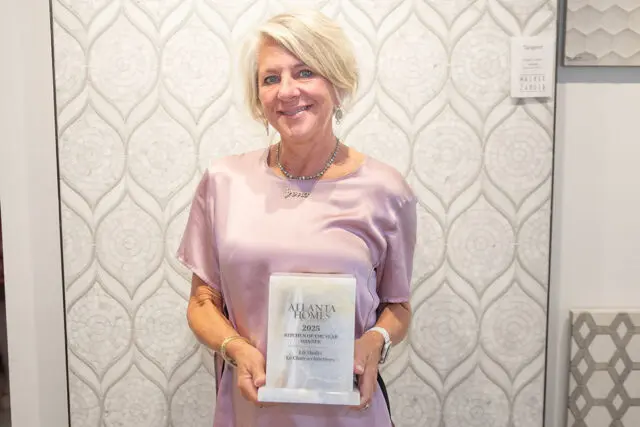 Woman holding Atlanta Homes 2025 Kitchen of the Year award.