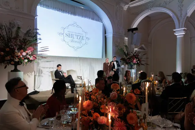 Philip Trammell Shutze Awards event with speakers at podium and seated guests at tables.